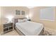 Cozy bedroom showcases a comfortable bed with stylish decor, complemented by natural light from a window at 16823 S 8Th St, Phoenix, AZ 85048