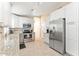 Well-lit kitchen featuring stainless steel appliances, white cabinets, and granite countertops at 16823 S 8Th St, Phoenix, AZ 85048
