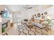 A well-lit living room with a fireplace, white shiplap wall, and tile flooring at 16823 S 8Th St, Phoenix, AZ 85048