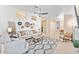 Open-concept living room features shiplap accent wall, neutral decor, and an inviting atmosphere at 16823 S 8Th St, Phoenix, AZ 85048