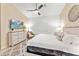Spacious main bedroom with a comfortable bed, a dresser, and a shiplap accent wall at 16823 S 8Th St, Phoenix, AZ 85048