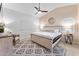 Relaxing main bedroom with a ceiling fan, a decorative rug, and a shiplap accent wall at 16823 S 8Th St, Phoenix, AZ 85048