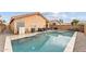 Backyard pool with patio seating and BBQ, enclosed by a block fence for privacy at 16823 S 8Th St, Phoenix, AZ 85048