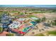 Breathtaking aerial view of resort-style pool, tennis and sport courts, and landscaped grounds at 172 S Agua Fria Ln, Casa Grande, AZ 85194