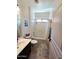 Bright bathroom with tile floors, shower-tub combination, and modern vanity at 172 S Agua Fria Ln, Casa Grande, AZ 85194