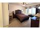 Comfortable bedroom featuring a ceiling fan and window at 172 S Agua Fria Ln, Casa Grande, AZ 85194