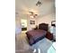 Bedroom with a bed, nightstand, and door leading to the bathroom at 172 S Agua Fria Ln, Casa Grande, AZ 85194