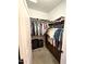 Walk-in closet with custom shelving and ample storage space at 172 S Agua Fria Ln, Casa Grande, AZ 85194