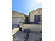 Attractive home exterior with desert landscaping, a seating area on the front porch, and a tiled roof at 172 S Agua Fria Ln, Casa Grande, AZ 85194