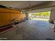 Spacious garage with storage cabinets and overhead door at 172 S Agua Fria Ln, Casa Grande, AZ 85194