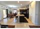 Open concept kitchen and dining area featuring dark cabinets, a center island, and backyard access at 172 S Agua Fria Ln, Casa Grande, AZ 85194