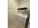 Laundry room with washer, dryer, and shelving at 172 S Agua Fria Ln, Casa Grande, AZ 85194