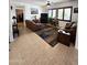 Cozy living room with comfortable seating, tile floors, and natural light at 172 S Agua Fria Ln, Casa Grande, AZ 85194