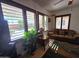 Living room with plantation shutters offering backyard views at 172 S Agua Fria Ln, Casa Grande, AZ 85194