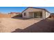 Expansive backyard features desert landscaping and a covered patio at 18508 E Dario Rd, Gold Canyon, AZ 85118