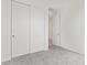 Cozy bedroom with closet featuring white sliding doors and neutral carpeting throughout at 18508 E Dario Rd, Gold Canyon, AZ 85118