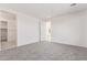 An empty bedroom with neutral carpet and paint, a door to the closet and another to another room at 18508 E Dario Rd, Gold Canyon, AZ 85118