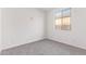 Bedroom with neutral carpet, white walls and a bright window allowing plenty of natural light at 18508 E Dario Rd, Gold Canyon, AZ 85118