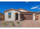 Charming single-story home featuring a tile roof, stucco exterior, and a spacious two-car garage at 18508 E Dario Rd, Gold Canyon, AZ 85118