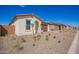Lovely single-story home features desert landscaping, paver driveway, and tile roof at 18508 E Dario Rd, Gold Canyon, AZ 85118