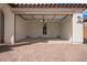 Spacious two-car garage with ample lighting and door to interior of home at 18508 E Dario Rd, Gold Canyon, AZ 85118