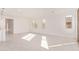 Open living space with neutral walls, tile flooring, recessed lighting, and large windows allowing lots of sunlight at 18508 E Dario Rd, Gold Canyon, AZ 85118