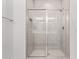 Contemporary shower with glass doors, white subway tile surround, and modern fixtures at 18508 E Dario Rd, Gold Canyon, AZ 85118