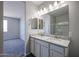 Elegant bathroom showcasing a double vanity with granite countertops at 19360 N Diego Way, Maricopa, AZ 85138