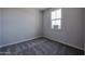 Comfortable bedroom with a window and neutral walls with soft carpet at 19360 N Diego Way, Maricopa, AZ 85138