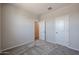 Cozy bedroom with neutral walls and plush gray carpet at 19360 N Diego Way, Maricopa, AZ 85138