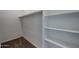 Organized closet featuring rod and shelving for ample storage solutions and maximizing space at 19360 N Diego Way, Maricopa, AZ 85138