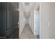 Inviting hallway with neutral tones, tile flooring, and ample lighting at 19360 N Diego Way, Maricopa, AZ 85138