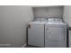 A laundry room featuring a white washer and dryer at 19360 N Diego Way, Maricopa, AZ 85138