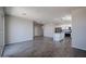 Open-concept living room with tile flooring and a view of the kitchen at 19360 N Diego Way, Maricopa, AZ 85138