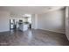 Spacious living room featuring tile flooring and ample natural light at 19360 N Diego Way, Maricopa, AZ 85138