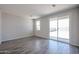 Bright living room with sliding glass door and tiled floors at 19360 N Diego Way, Maricopa, AZ 85138