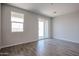 Inviting living room with tiled floors, a window and a glass sliding door at 19360 N Diego Way, Maricopa, AZ 85138