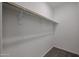 Neat walk-in closet featuring a hanging rod for ample storage at 19360 N Diego Way, Maricopa, AZ 85138
