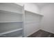 Organized walk-in closet featuring built-in shelving and a hanging rod at 19360 N Diego Way, Maricopa, AZ 85138