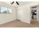 Bright bedroom featuring neutral tile flooring, a window, and a closet at 2019 W Wayland Rd, Phoenix, AZ 85041