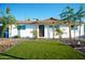 Beautifully landscaped front yard featuring a well maintained yard, complemented by mature trees and desert landscaping at 2019 W Wayland Rd, Phoenix, AZ 85041