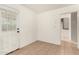 Clean and bright interior with tile flooring and a view of the kitchen area at 2019 W Wayland Rd, Phoenix, AZ 85041