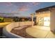 Outdoor patio area with a covered pergola, perfect for enjoying warm evenings and outdoor dining at 20301 N Queen Palm Ln, Surprise, AZ 85374