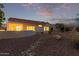 Backyard exterior featuring well-maintained desert landscaping and block wall at 20301 N Queen Palm Ln, Surprise, AZ 85374
