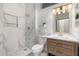 Modern bathroom with marble finishes, a glass-enclosed shower, and elegant fixtures at 20301 N Queen Palm Ln, Surprise, AZ 85374
