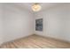 Neutral bedroom has wood-look floors and a window view at 20301 N Queen Palm Ln, Surprise, AZ 85374