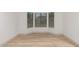 Bright, empty bedroom features a bay window offering plenty of natural light at 20301 N Queen Palm Ln, Surprise, AZ 85374