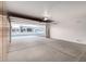 Spacious garage featuring built-in storage and an open view to the home's exterior at 20301 N Queen Palm Ln, Surprise, AZ 85374