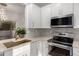 Close-up of updated kitchen with stainless appliances and quartz countertops at 20301 N Queen Palm Ln, Surprise, AZ 85374