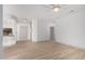 Bright and airy living room featuring stylish wood flooring and a modern ceiling fan at 20301 N Queen Palm Ln, Surprise, AZ 85374
